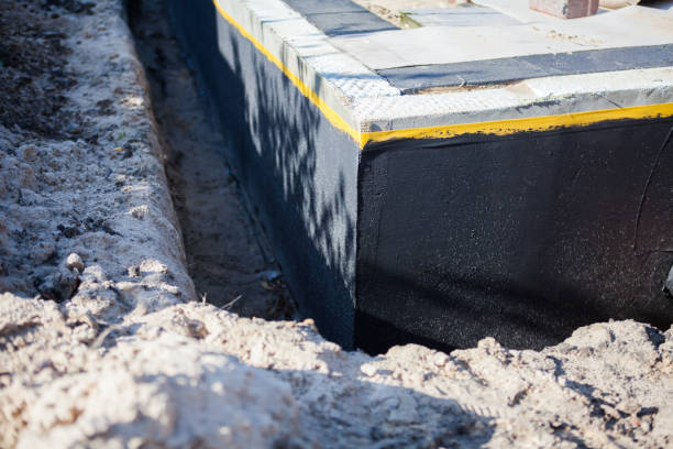 Professional Waterproofing technician working in Duluth, MN
